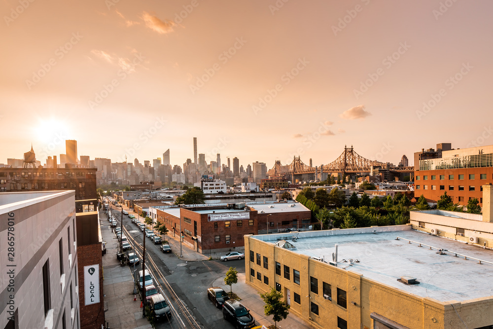 Long island City, New York City/ USA - 08 21 2017: Sunset view to the Queensboro Bridge and Manhattan skyline in LIC NYC Big Apple with skyscrapers and the amazing skyline of the metropolis