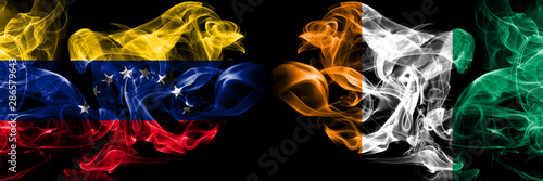 Venezuela, Venezuelan, Ivory Coast smoky mystical flags placed side by side. Thick colored silky smokes flag concept