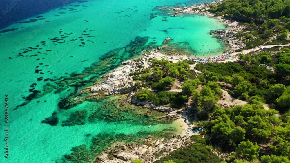 Aerial drone video of iconic turquoise paradise rocky beach of Kavourotripes in Sithonia Peninsula, Halkidiki, North Greece Aerial drone video of iconic turquoise paradise rocky beach of Kavourotripes in Sithonia Peninsula, Halkidiki, North Greece
