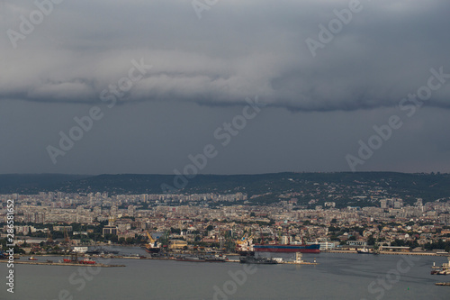 The city of Varna during the storm. The downpour is approaching the sea coast. The Bulgarian resorts in the summer. European recreation area. Thunderhead covers the city. 