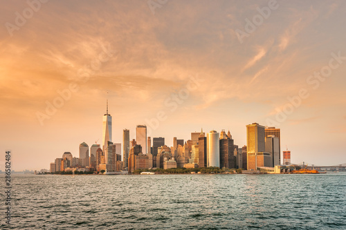 New York City New Jersey, NYC/ USA - 08 21 2017: Amazing sunset on New York City Hudson River on public transport staten island ferry with beautiful panorama view to NYC Manhattan skyline