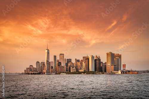 New York City New Jersey, NYC/ USA - 08 21 2017: Amazing sunset on New York City Hudson River on public transport staten island ferry with beautiful panorama view to NYC Manhattan skyline