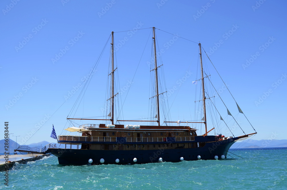 Beautiful caravel in the Aegean Sea. Entertainment for tourists and joy for children Beautiful caravel in the Aegean Sea. Entertainment for tourists and joy for children