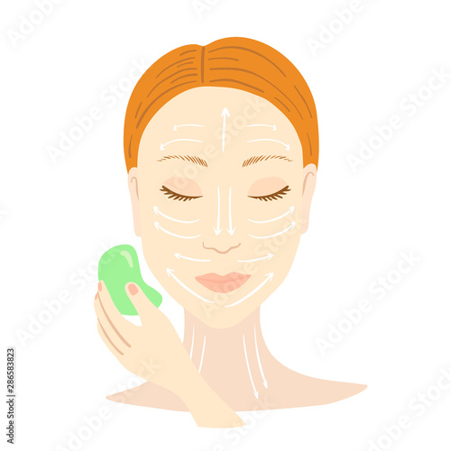 Gua Sha facial massage. Woman with scraper.