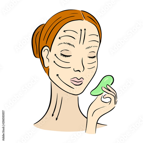 Gua Sha facial massage. Woman with scraper.