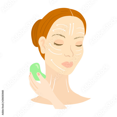 Gua Sha facial massage. Woman with scraper.