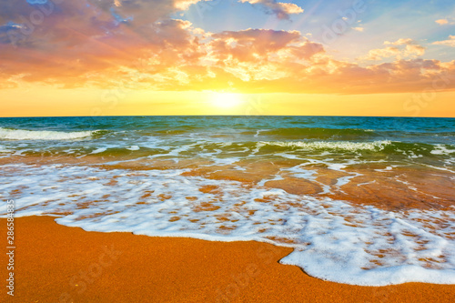 beautiful summer sandy sea beach scene at the sunset