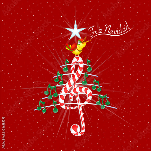Christmas tree made of green musical notes, candy bar shaped treble clef and pentagram with title: FELIZ NAVIDAD -MERRY CHRISTMAS in spanish language- on red background with stars photo