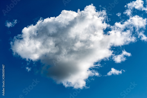 White  Fluffy Clouds In Blue Sky. Abstract Background From Clouds.