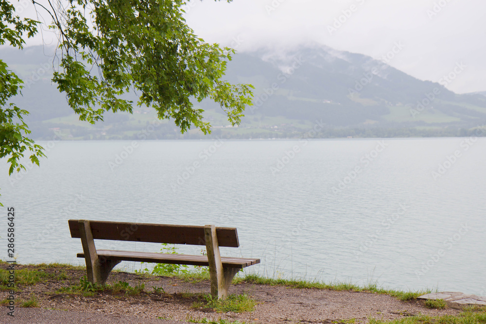 a bench by a lake in Aistrian alps