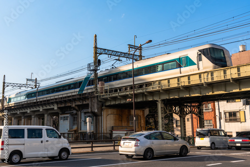 Passenger train on a elevated railway line in an urban settingon a clear winter day