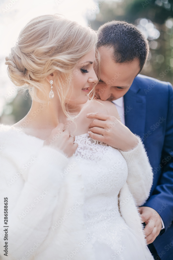 Happy bride and groom on their wedding in garden Happy bride and groom on their wedding in garden