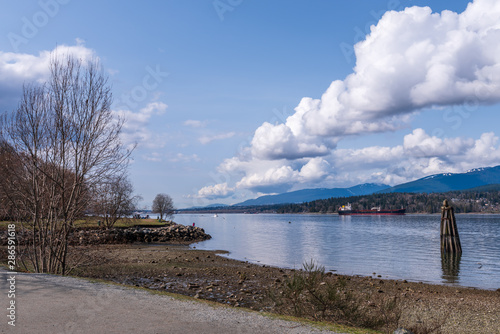 View over Burrard Inlet  ocean and island with boat and mountains in beautiful British Columbia. Canada.