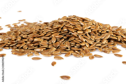 Linseed, flaxseed, linum isolated on white. Vegan and healthy eating concept.