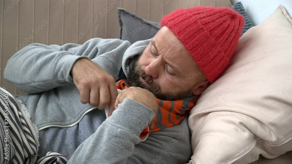 Influenza Virus Infected Young Man He Sits At Home Having Wrapped In Warm Clothing Temperature Cough Runny Nose Fever Allergy Antibiotic Antiseptic Analgesic Antistress Allergy Healthcare Concept Influenza Virus Infected Young Man He Sits At Home Having Wrapped In Warm Clothing Temperature Cough Runny Nose Fever Allergy Antibiotic Antiseptic Analgesic Antistress Allergy Healthcare Concept