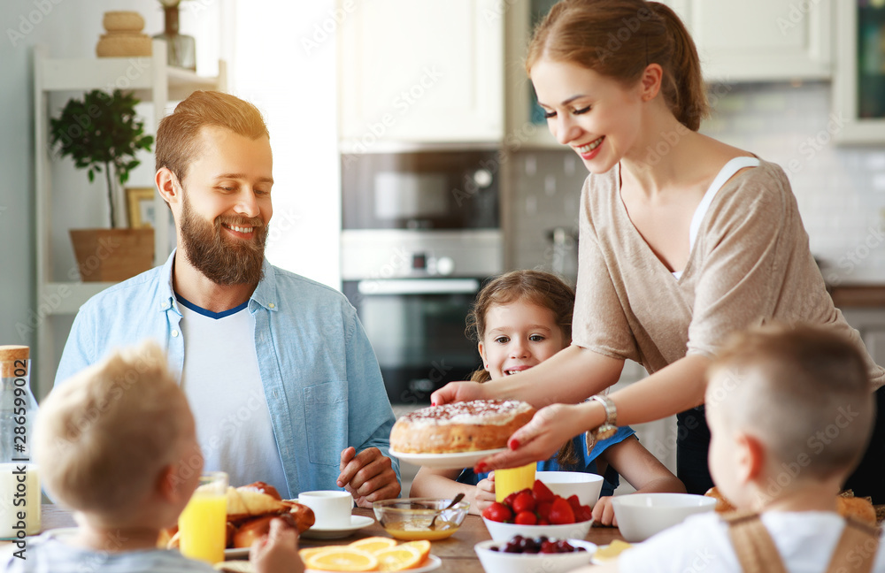 family mother father and children have Breakfast in kitchen in morning. family mother father and children have Breakfast in kitchen in morning.