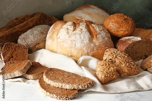 Assortment of fresh bread on table