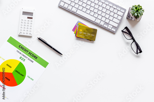 credit score with bank cards and keyboard on white background top view mockup
