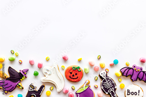 Halloween decorations frame on white background top view copyspace