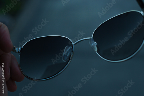 sunglasses on black background