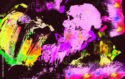 a dark background with yellow and pink paint stains