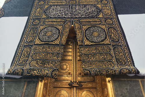 MECCA, SAUDI ARABIA - September 2019. The door of the Kaaba holy mosque Al-Haram in Mecca Saudi Arabia. Muslim pilgrims from all over the world gathered to perform Umrah or Hajj.
