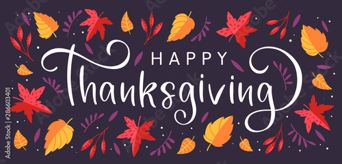 Background with colorful autumn leaves and hand drawn lettering Happy Thanksgiving