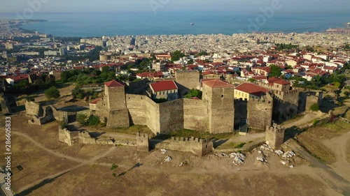 Aerial drone video of iconic byzantine Eptapyrgio or Yedi Kule medieval fortress overlooking city of Salonica or Thessaloniki, North Greece photo