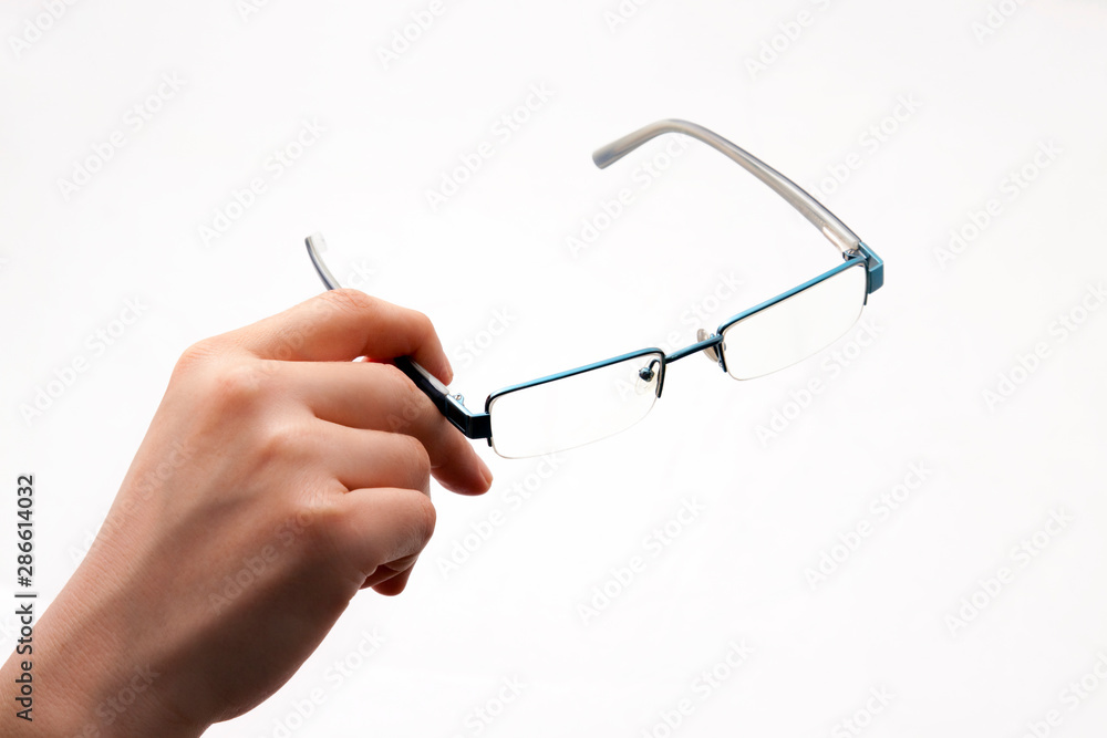 hand holding glasses on white background hand holding glasses on white background