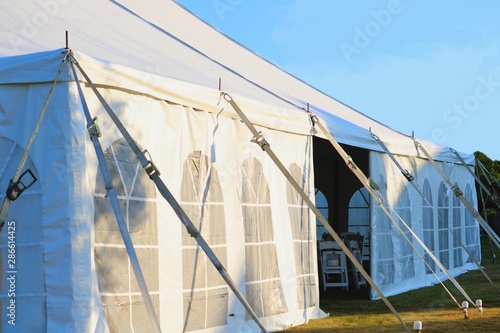 side of a large white entertainment or wedding tent
