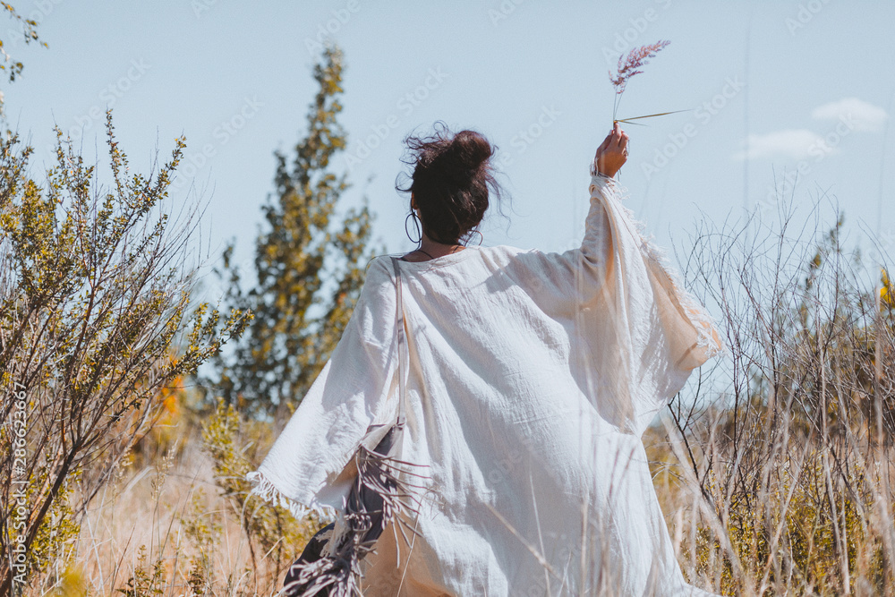 © zolotareva_elina - beautiful young woman walking on a field