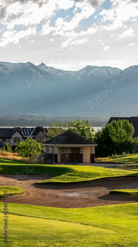 Vertical Golf course and residential area overlooking the lake mountain and valley