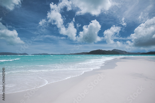 Fototapeta Naklejka Na Ścianę i Meble -  Amazing landscape of White Haven Beach in Australia, white silica sand, and turquoise water, on a sunny day, the best beach in the world for summer destination.