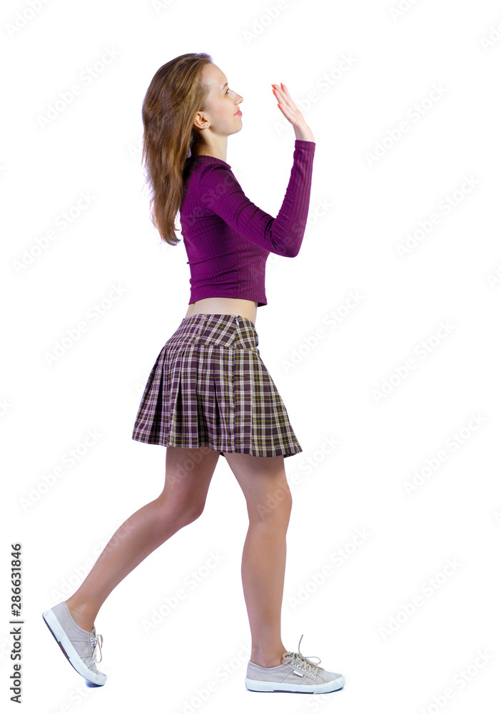 Naklejka premium Back view of a woman who comes welcomes someone with hand.