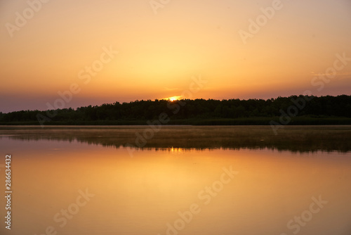 Beautiful morning landscape of shores of lake © EverGrump
