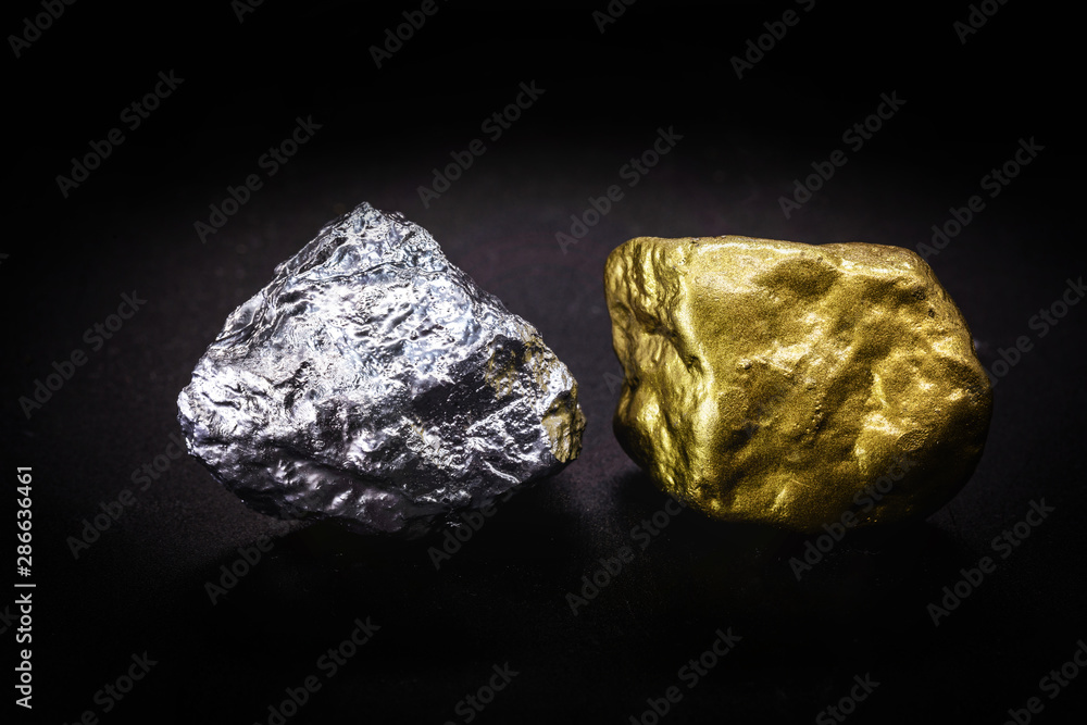 Gold and silver nuggets on black background. Precious stones, luxury concept and mineral drainage. Industrial activity, treasure and fortune.