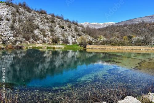 lake in the mountains/Blue oasis surrounded whit mountain/ Mountain scenery with meadows, peaks and glacier lakes in Croatia, beautiful view at river Cetina- Blue Eye