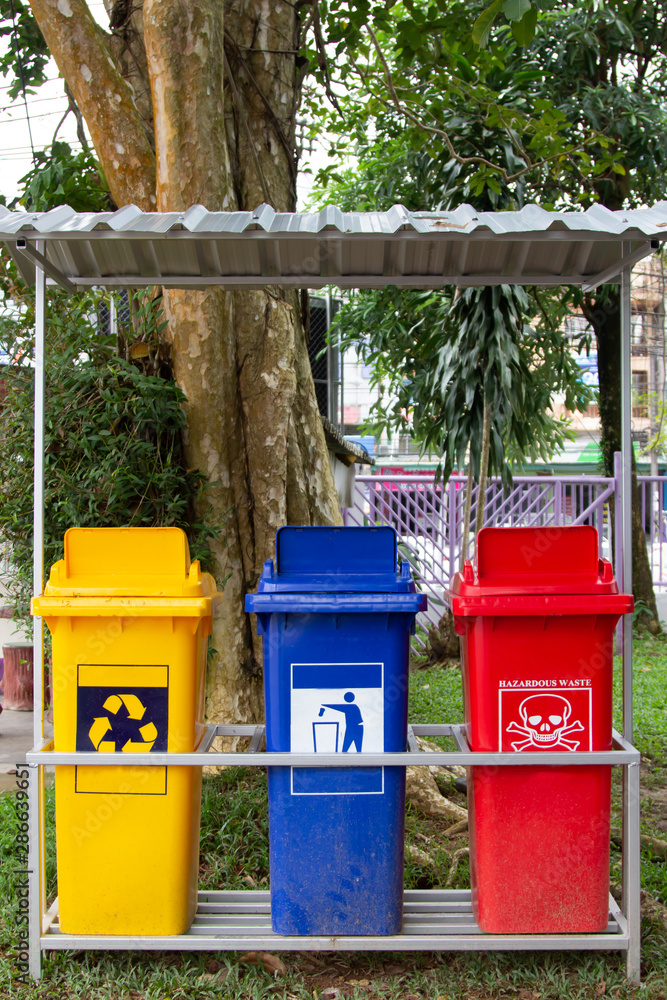 Set of various colorful garbage bins Located on the cement floor . Trash containers for garbage sorting. Set of various colorful garbage bins Located on the cement floor . Trash containers for garbage sorting.