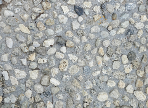  gray stone pebbles concrete floor texture, gravel material background pattern.  