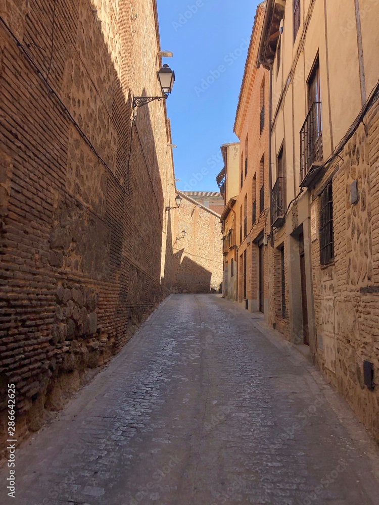 narrow street in old town of toledo narrow street in old town of toledo