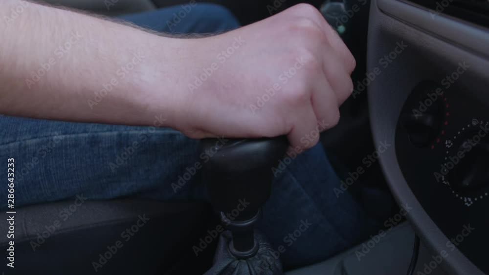 Driver man controls auto and switch gears. Close up of gear shift in car. Gearbox auto of manual transmission. Driver man controls auto and switch gears. Close up of gear shift in car. Gearbox auto of manual transmission.