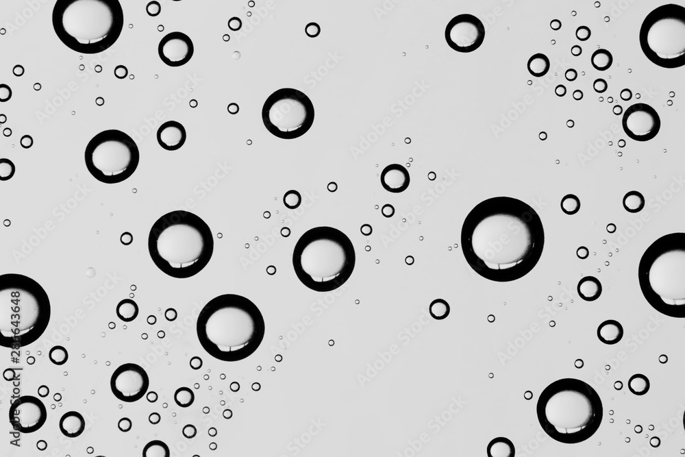 gray wet background / raindrops to overlay on the window, weather, background drops of water rain on the glass transparent gray wet background / raindrops to overlay on the window, weather, background drops of water rain on the glass transparent