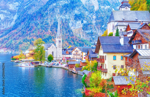 Lake Hallstatt, Austria. Seasonal autumn view of Hallstatt village on the bank of Hallstatter lake in Highlands of Alps mountains. Picturesque autumn morning scenery. UNESCO world heritage site. photo