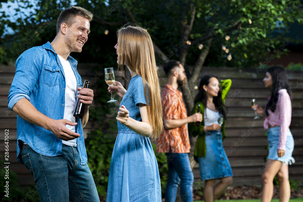 Front view friends with drinks dancing