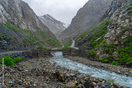 Cross the bridge and view the mountains