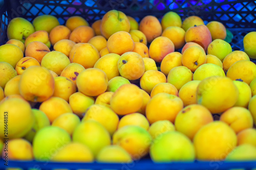 ripe juicy apricots on a store counter. close-up. selective focus