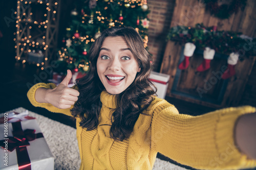 Wallpaper Mural Self photo of nice cute charming good festive attractive beautiful girl thumbing up while standing in front of christmas tree and wearing yellow sweater Torontodigital.ca