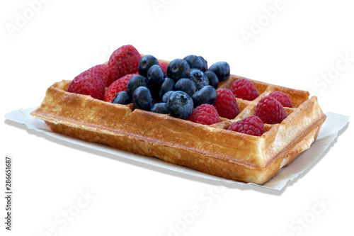 Waffle with fruits - strawberries, blueberries and raspberries