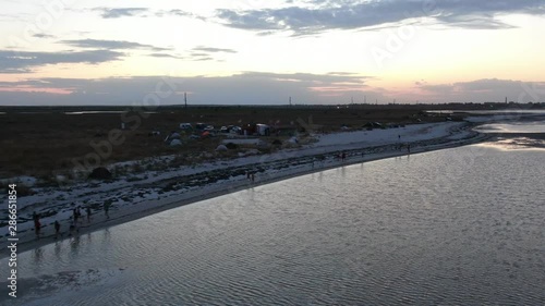 Wallpaper Mural A lot of people are running along the beach near the water in the evening Torontodigital.ca