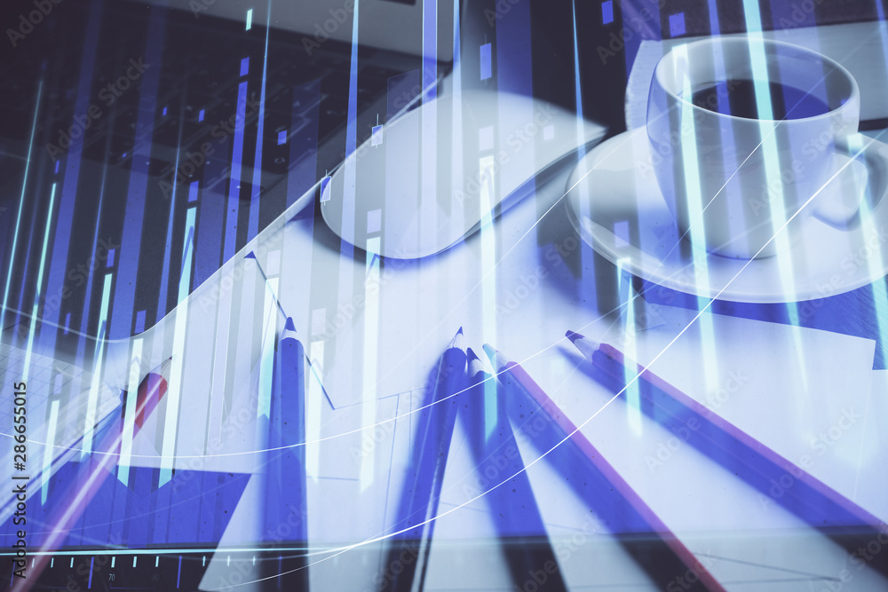 Fototapeta premium Stock market chart hologram drawn on personal computer background. Multi exposure. Concept of investment.
